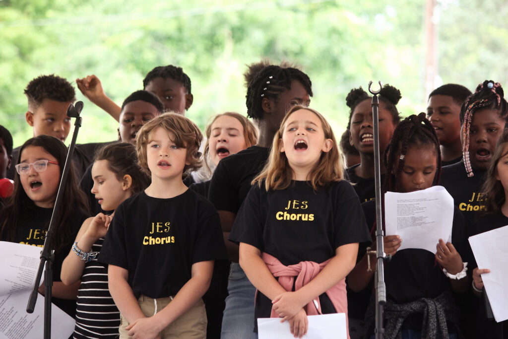 Elementary children singing in a chorus